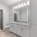 Apartment bathroom with a walk-in closet inside a home at Stono Oaks