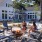 two ladies sit around the fire pit and roast marshmallows