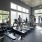 residents work out in large fitness center