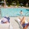 people relax on in-pool lounge chairs